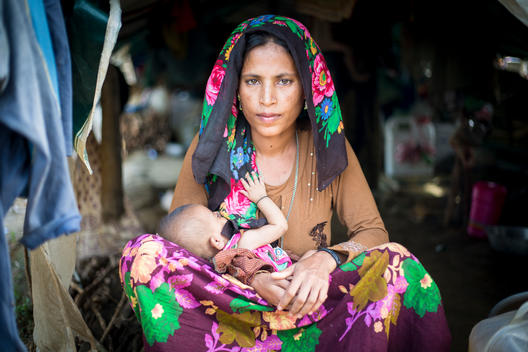 Portrait of woman with 3 months old baby in Refugee Camp in Bangladesh.